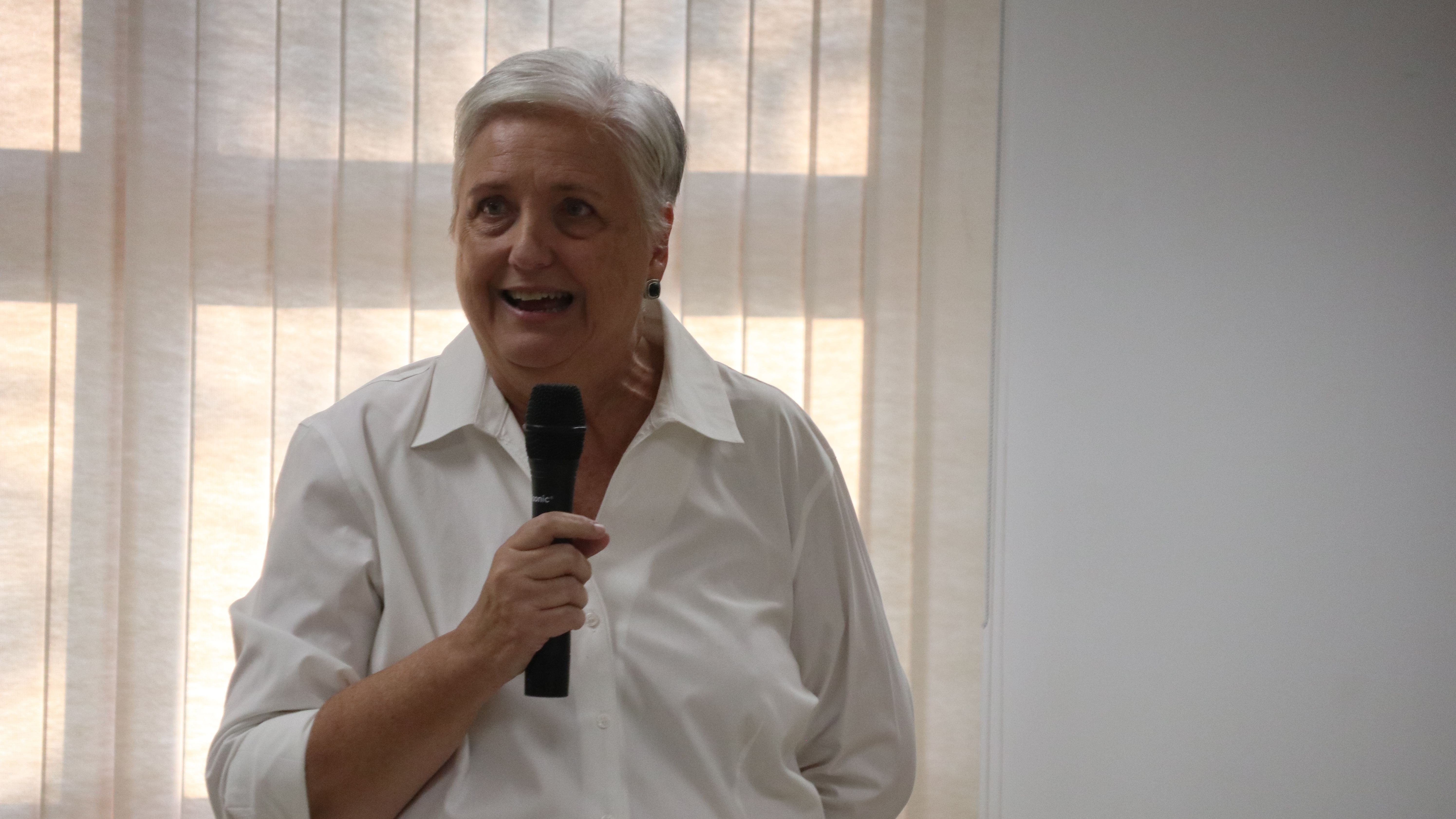 Photo of Marleen Menendez Suarez delivering her talk on preparing local families for separation and deportation.